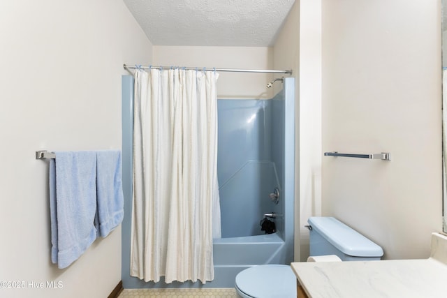 bathroom with vanity, toilet, a textured ceiling, and shower / tub combo