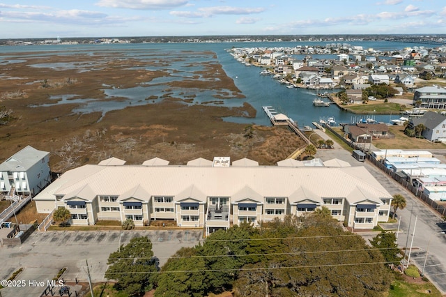 birds eye view of property featuring a residential view and a water view