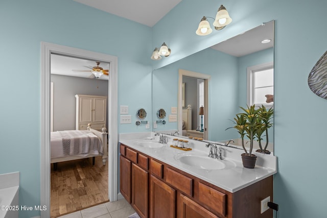 1203 Strange Ct, Morehead City, NC 28557 - bathroom with connected bathroom, double vanity, a ceiling fan, and tile patterned flooring