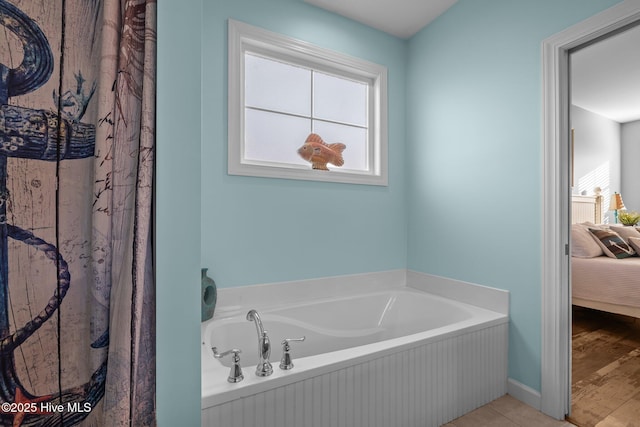 1203 Strange Ct, Morehead City, NC 28557 - full bathroom with ensuite bathroom, a bath, and baseboards