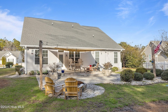 1203 Strange Ct, Morehead City, NC 28557 - rear view of house featuring a patio area, a fire pit, and a shingled roof
