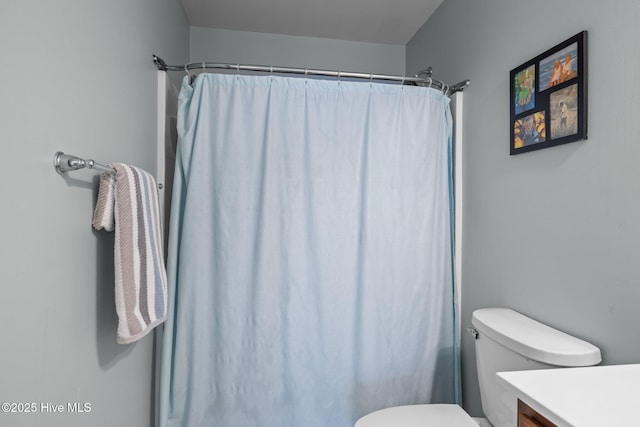 1203 Strange Ct, Morehead City, NC 28557 - full bathroom featuring vanity, toilet, and a shower with shower curtain