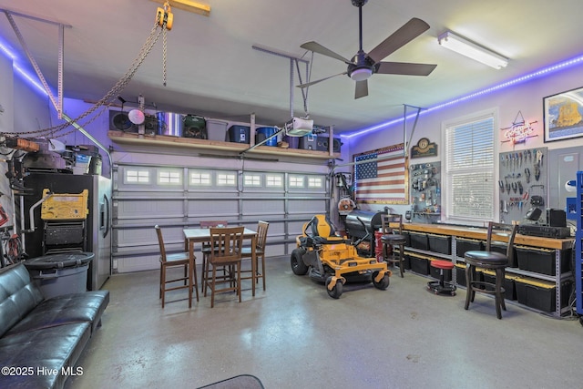 1203 Strange Ct, Morehead City, NC 28557 - garage featuring ceiling fan and a garage door opener