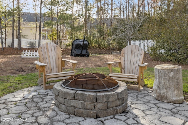 1203 Strange Ct, Morehead City, NC 28557 - view of patio / terrace featuring an outdoor fire pit and fence