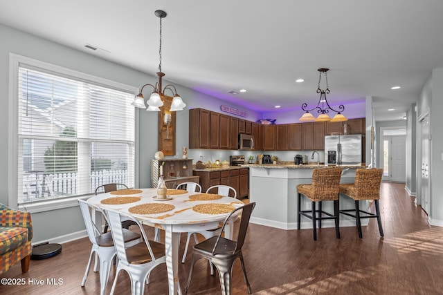 1203 Strange Ct, Morehead City, NC 28557 - dining space with dark wood-style flooring, baseboards, recessed lighting, and a chandelier
