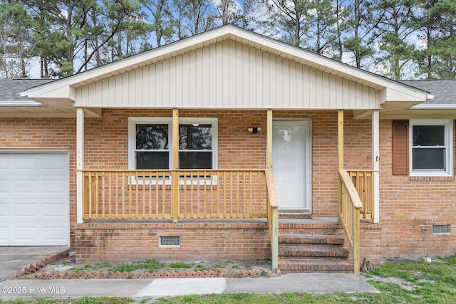 view of front of home featuring covered porch, an attached garage, a shingled roof, crawl space, and brick siding