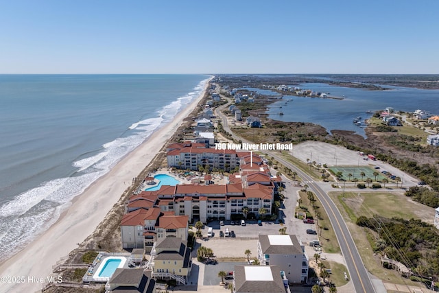 bird's eye view with a water view and a view of the beach