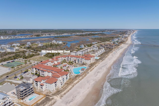 bird's eye view featuring a beach view and a water view