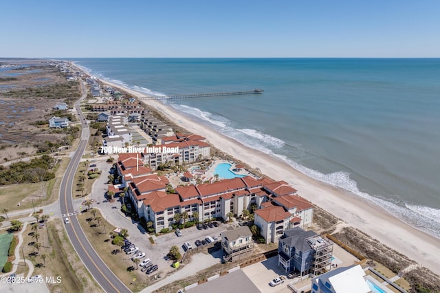 bird's eye view featuring a view of the beach and a water view