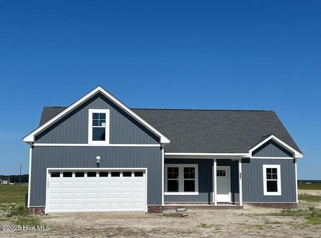 481 N Trotman Rd, Camden, NC 27921 - view of front of property featuring covered porch, roof with shingles, and dirt driveway