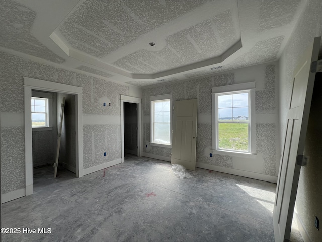 481 N Trotman Rd, Camden, NC 27921 - unfurnished bedroom featuring multiple windows and a tray ceiling