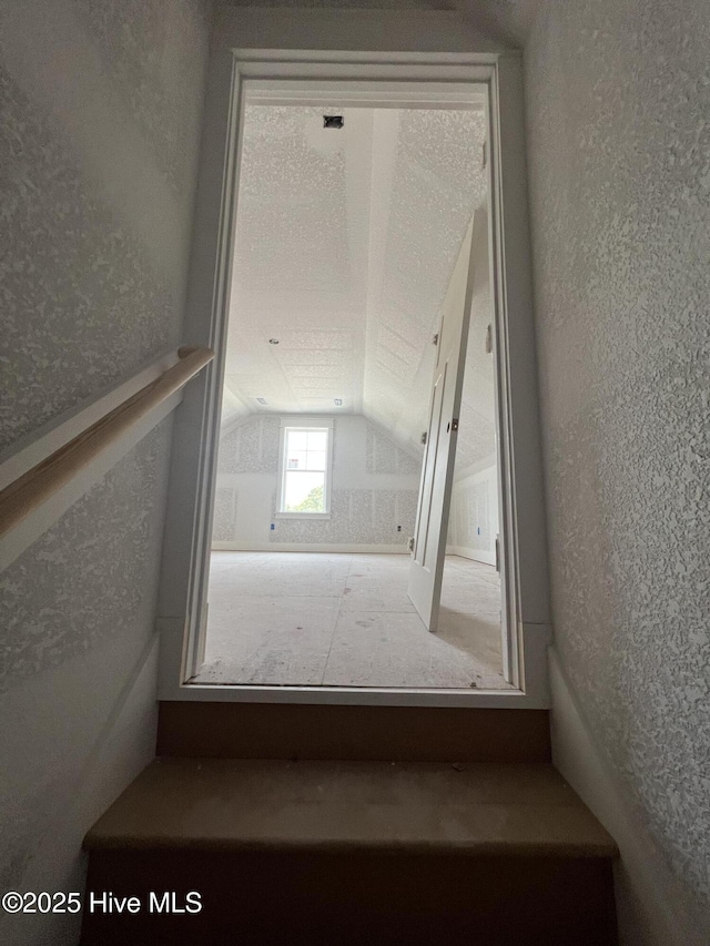 481 N Trotman Rd, Camden, NC 27921 - stairway featuring lofted ceiling and a textured wall