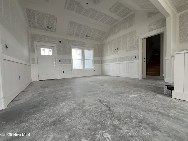481 N Trotman Rd, Camden, NC 27921 - unfurnished living room featuring wainscoting and high vaulted ceiling
