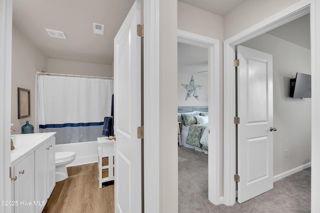 3659 Roseblossom Dr, Leland, NC 28451 - bathroom with visible vents, a shower with curtain, toilet, wood finished floors, and vanity