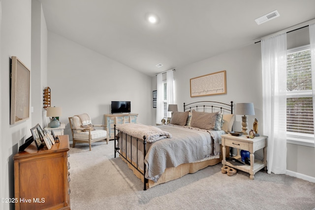 3659 Roseblossom Dr, Leland, NC 28451 - bedroom with vaulted ceiling, multiple windows, carpet, and visible vents