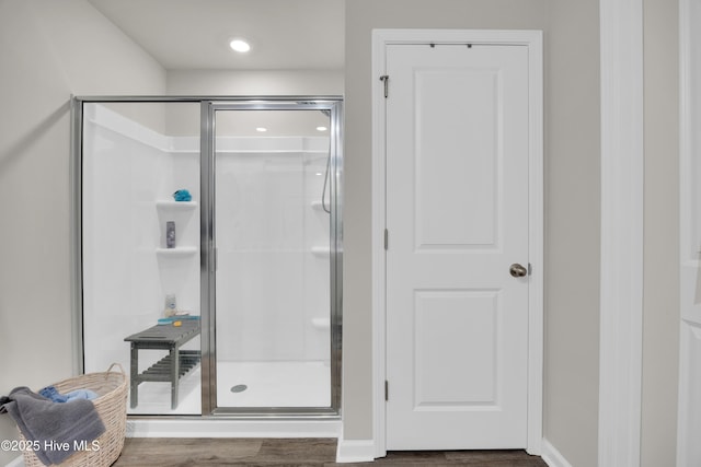 3659 Roseblossom Dr, Leland, NC 28451 - bathroom with a stall shower, baseboards, and wood finished floors