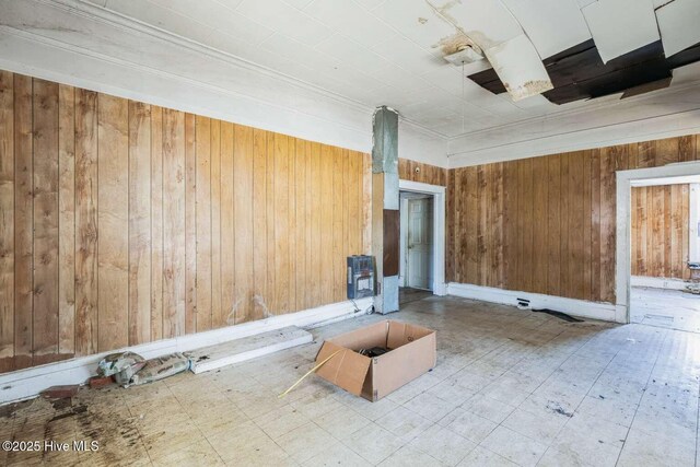 901 Daughtridge St, Rocky Mount, NC 27801 - unfurnished room with wooden walls, crown molding, and tile patterned floors