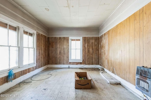 901 Daughtridge St, Rocky Mount, NC 27801 - spare room with heating unit, crown molding, wooden walls, and baseboards