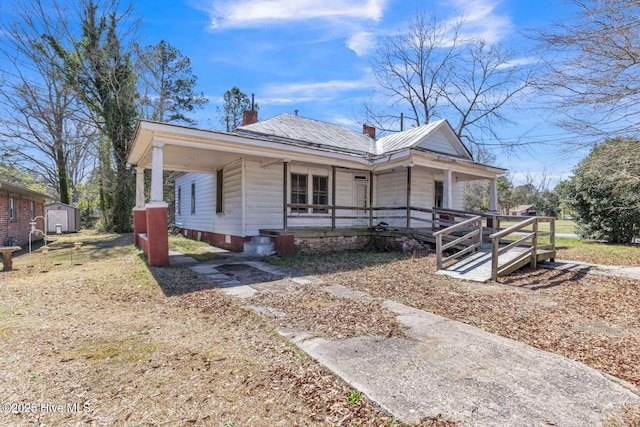 901 Daughtridge St, Rocky Mount, NC 27801 - view of front of property with a porch, a shed, an outbuilding, and a chimney