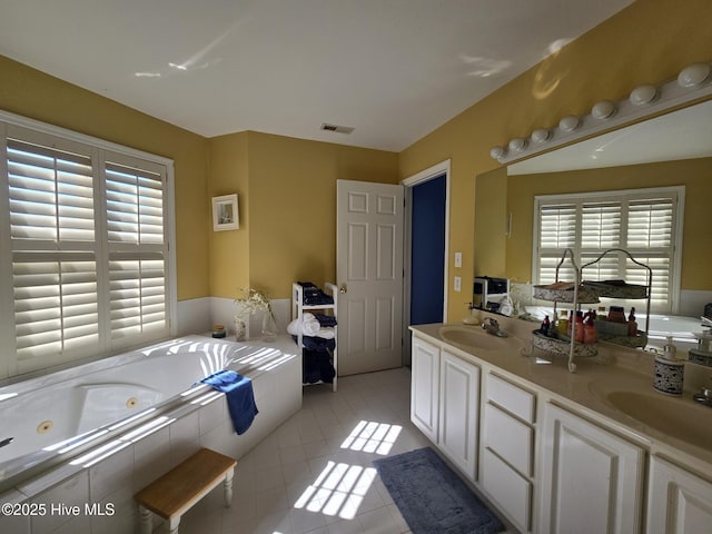 405 Commerce Ave Unit A, Morehead City, NC 28557 - bathroom featuring plenty of natural light, a sink, and tile patterned floors