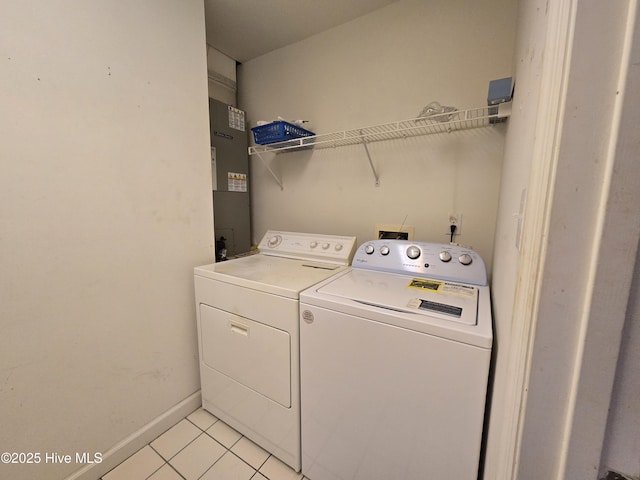 405 Commerce Ave Unit A, Morehead City, NC 28557 - clothes washing area with laundry area, baseboards, light tile patterned flooring, and washer and dryer