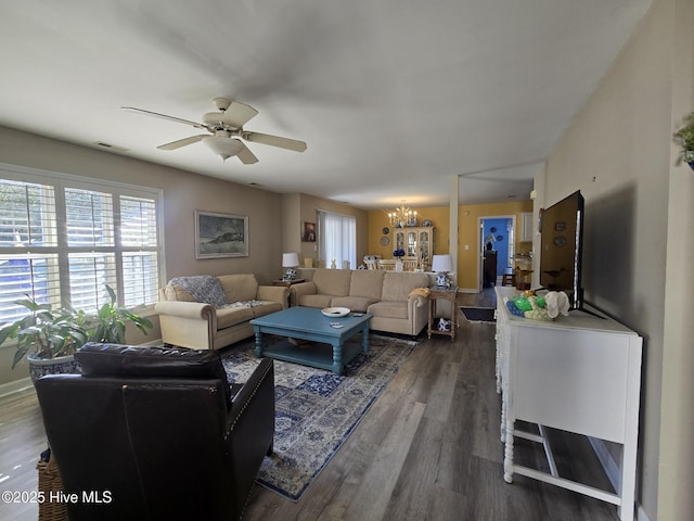 405 Commerce Ave Unit A, Morehead City, NC 28557 - living room featuring ceiling fan with notable chandelier, wood finished floors, and visible vents
