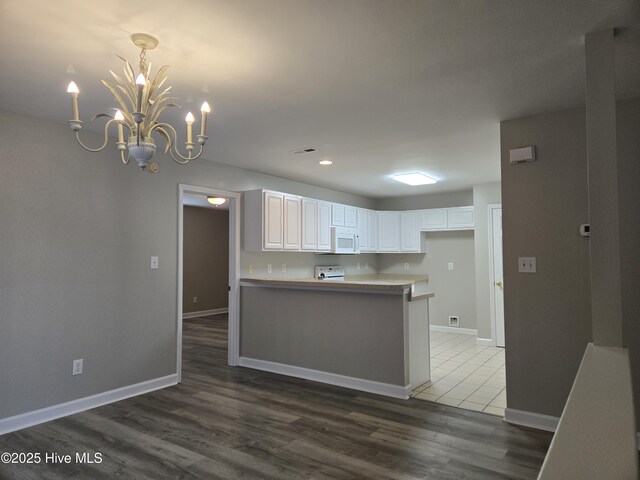 405 Commerce Ave Unit A, Morehead City, NC 28557 - living area with a chandelier, wood finished floors, and ceiling fan