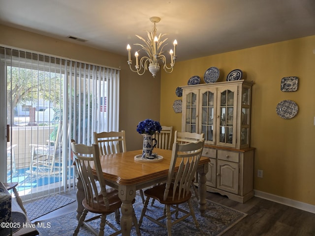 405 Commerce Ave Unit A, Morehead City, NC 28557 - dining room with an inviting chandelier, plenty of natural light, dark wood finished floors, and visible vents