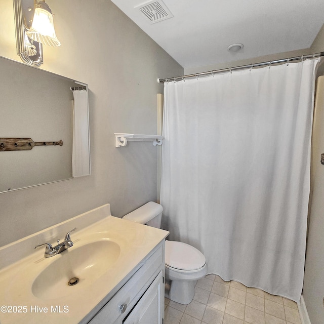bathroom featuring tile patterned floors, toilet, curtained shower, vanity, and visible vents
