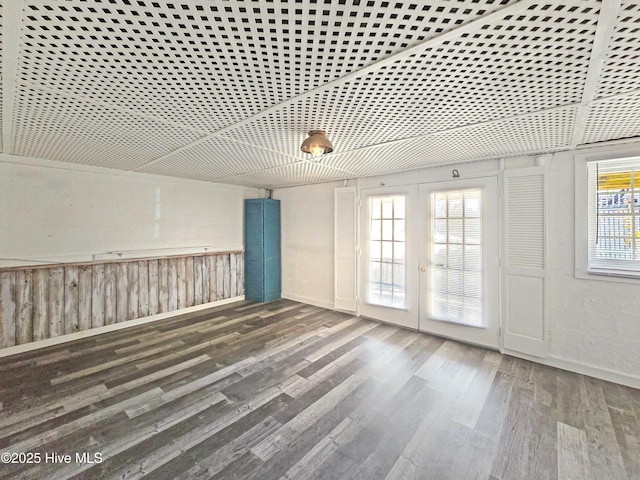 unfurnished room featuring wood finished floors and french doors