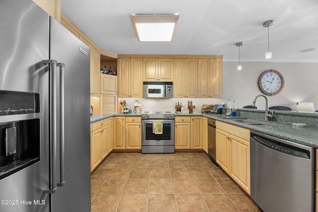 23 Batts Hill Rd, New Bern, NC 28562 - kitchen featuring appliances with stainless steel finishes, a sink, light brown cabinetry, pendant lighting, and tasteful backsplash