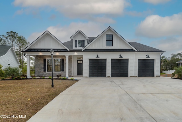 modern farmhouse style home with a garage, board and batten siding, concrete driveway, and a front lawn