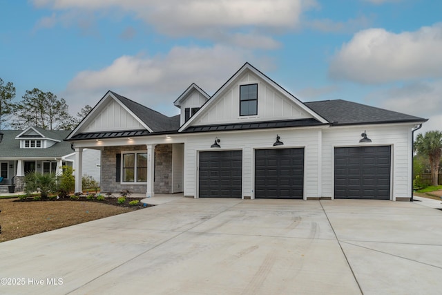 modern inspired farmhouse featuring a standing seam roof, board and batten siding, concrete driveway, metal roof, and a garage