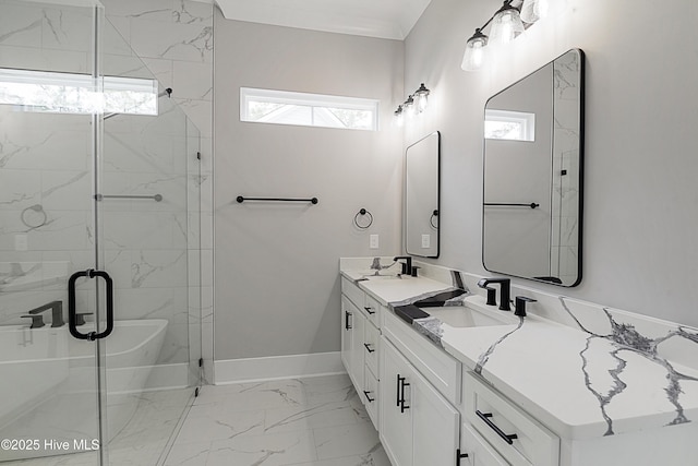 bathroom with marble finish floor, a stall shower, a sink, double vanity, and baseboards