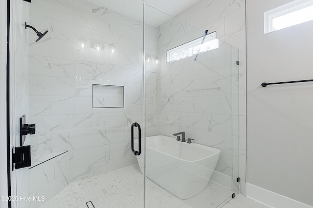 bathroom featuring a shower stall and baseboards