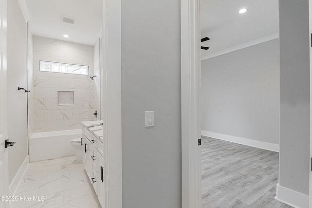 bathroom with vanity, visible vents, baseboards, and marble finish floor