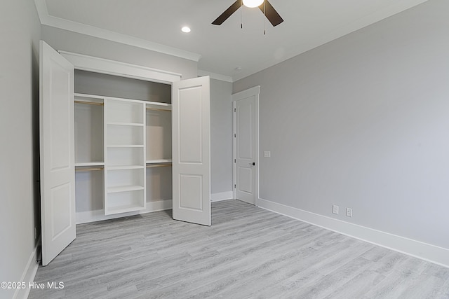 unfurnished bedroom featuring a closet, light wood-style flooring, and baseboards