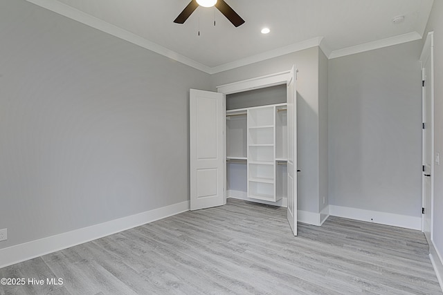 unfurnished bedroom with light wood finished floors, crown molding, and baseboards