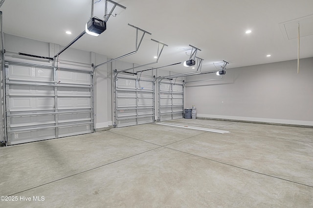 garage with a garage door opener and baseboards