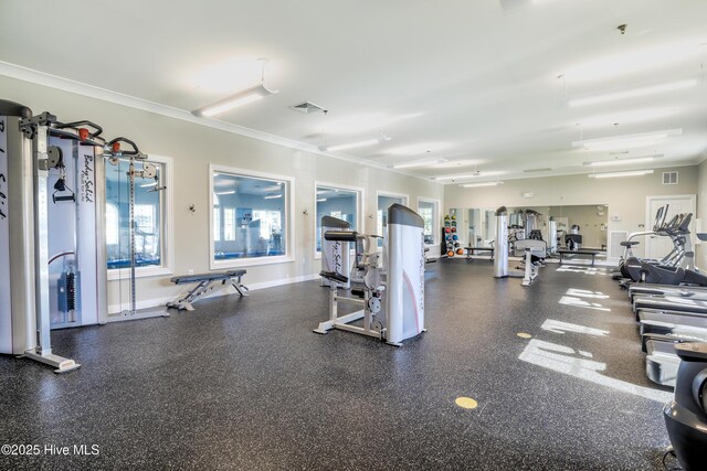 gym featuring visible vents, crown molding, and baseboards