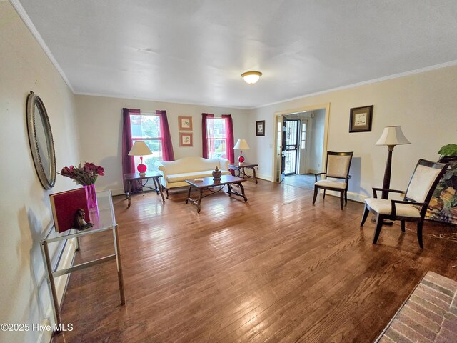 203 Crescent Dr, Windsor, NC 27983 - living room with a fireplace, wood finished floors, ornamental molding, and baseboards