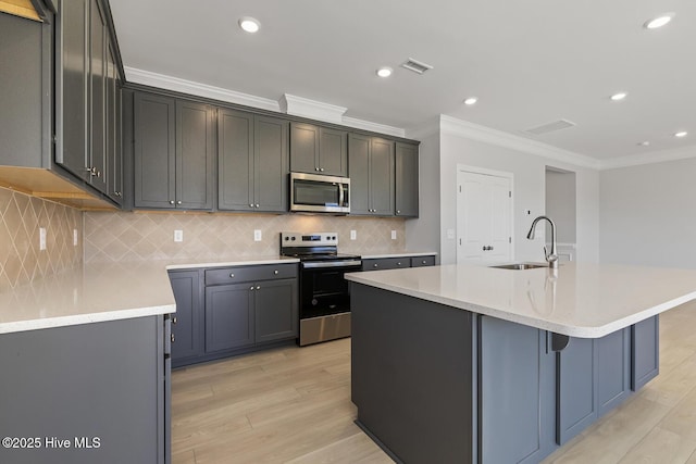 3700 Cessna Way W, Wilson, NC 27896 - kitchen featuring stainless steel appliances, ornamental molding, a sink, light wood-style floors, and recessed lighting