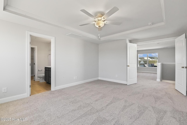 3700 Cessna Way W, Wilson, NC 27896 - carpeted empty room featuring ceiling fan, a tray ceiling, crown molding, baseboards, and a smoke detector