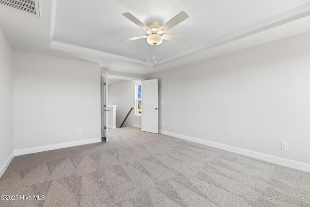 3700 Cessna Way W, Wilson, NC 27896 - carpeted empty room with a tray ceiling, crown molding, baseboards, and a ceiling fan