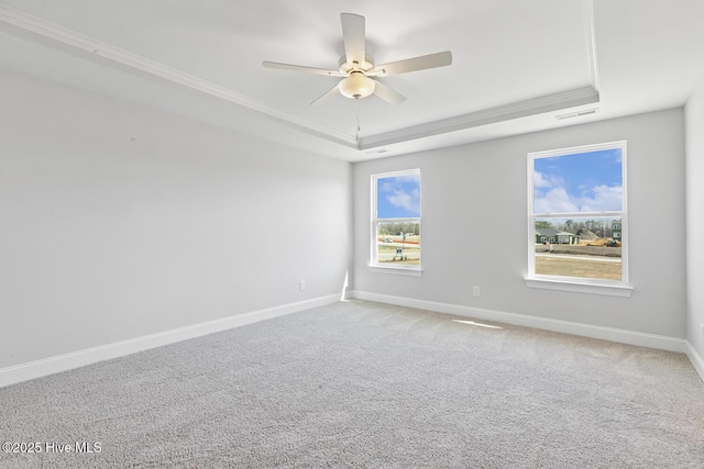 3700 Cessna Way W, Wilson, NC 27896 - spare room featuring a raised ceiling, baseboards, a ceiling fan, light colored carpet, and crown molding
