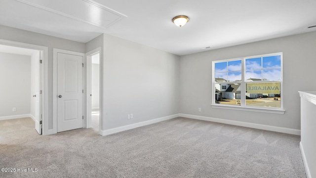 3700 Cessna Way W, Wilson, NC 27896 - unfurnished bedroom with attic access, carpet floors, and baseboards