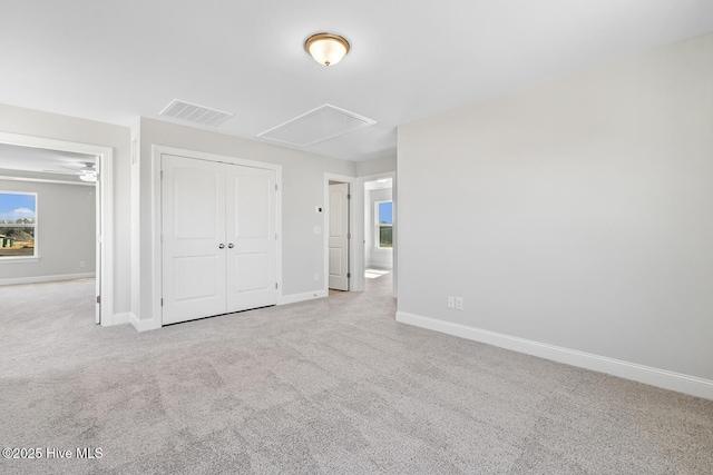 3700 Cessna Way W, Wilson, NC 27896 - unfurnished bedroom with attic access, carpet flooring, baseboards, and a closet
