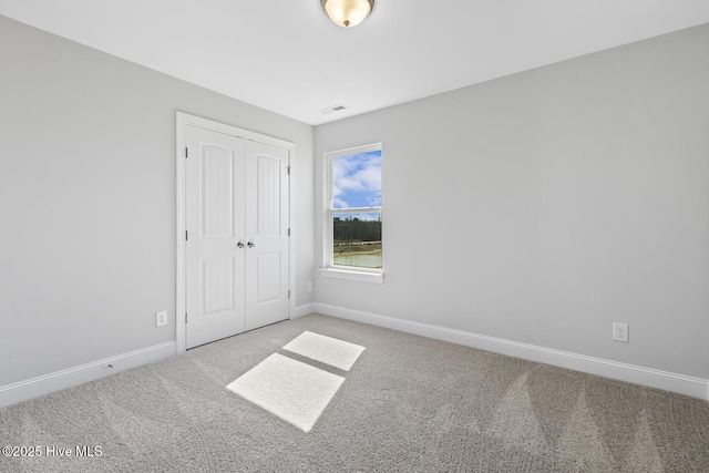 3700 Cessna Way W, Wilson, NC 27896 - unfurnished bedroom featuring carpet flooring, baseboards, and a closet