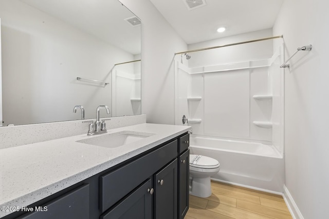 3700 Cessna Way W, Wilson, NC 27896 - full bathroom with vanity, toilet, wood finished floors, shower / tub combination, and baseboards