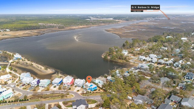 birds eye view of property with a water view and a residential view